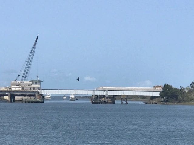 Onslow Beach swing bridge, waiting for the 3 PM opening. Other boats trapped between bridge and live fire exercise zone.