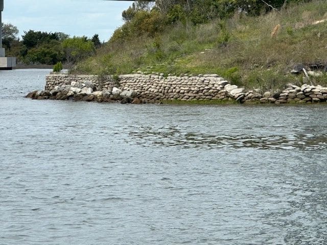 Retaining wall made of bags of concrete.
