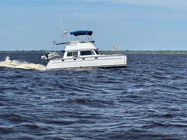 Gold loopers (see yellow flag on bow) passing in the sporty seas of Alligator River. See you later at docktails!