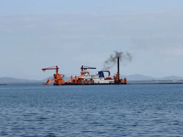 Multiple dredges provding land for the new manmade Andaman Island.