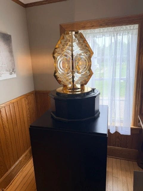 The famous Fresnel lens, focuses a small amount of light into a single bright beam. This lens is a Sixth Order, which is the smallest size, typically used to mark harbor entrances.