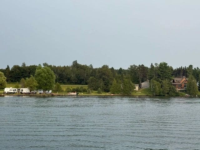 There are people along the shore enjoying the day!